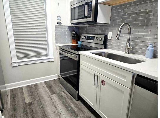 Modern kitchen with stainless appliances - turnover complete